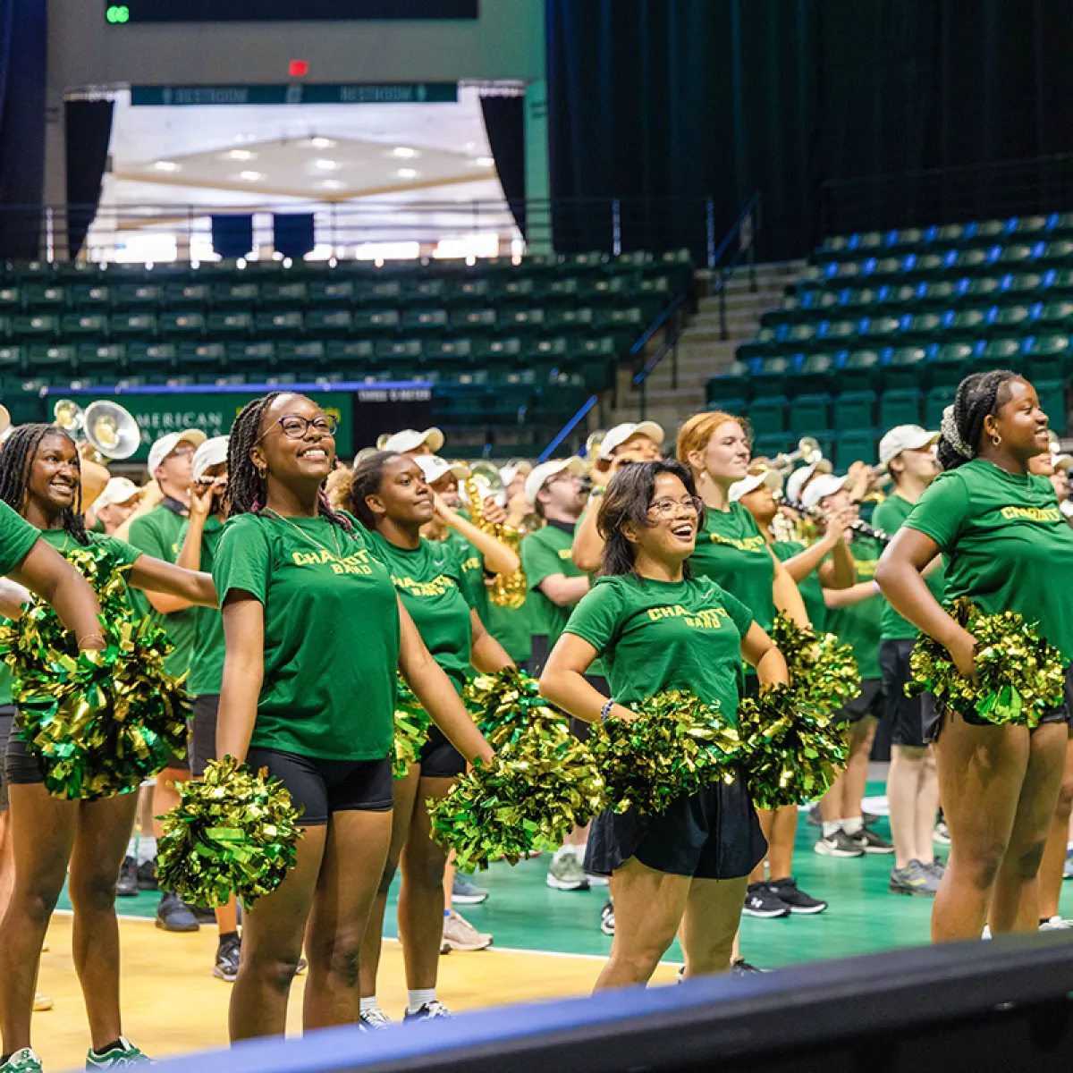 Cheerleaders and marching band on Halton Arena floor